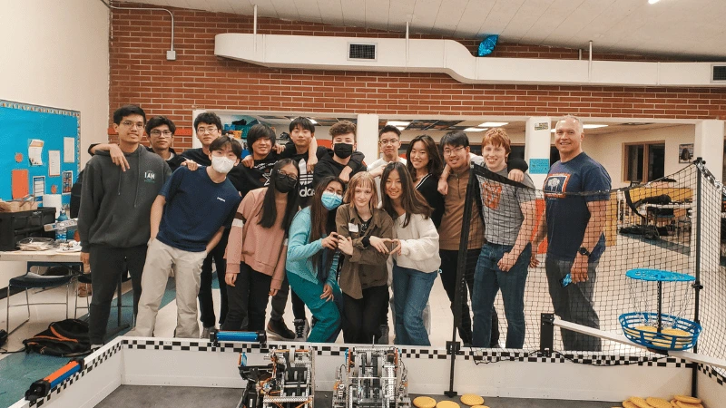 Group photo of the Mukilteo Robotics team at a competition.